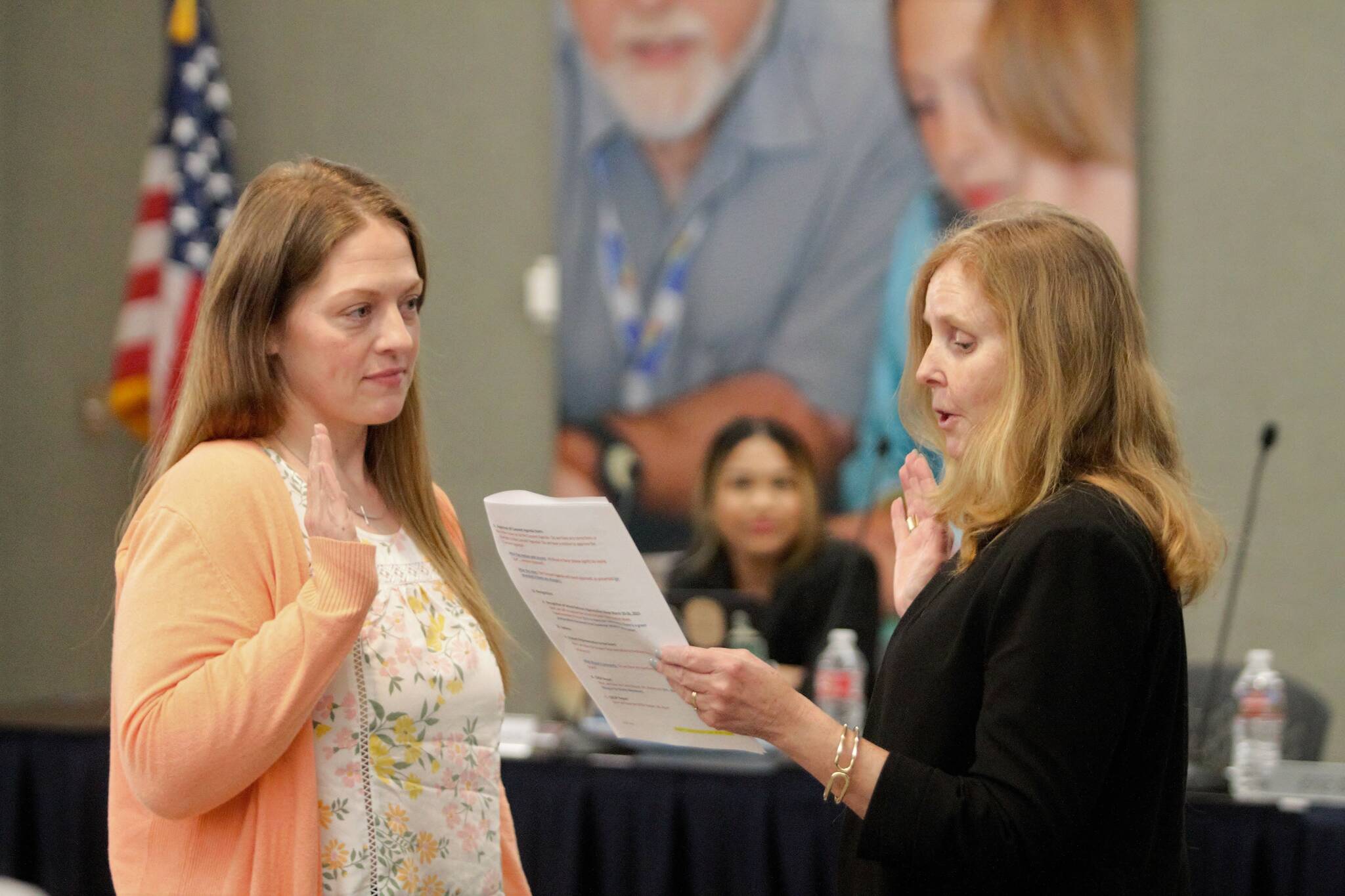 Kristin Hay (left) takes the oath of office before her fellow board directors March 22. Elisha Meyer/Kitsap News Group