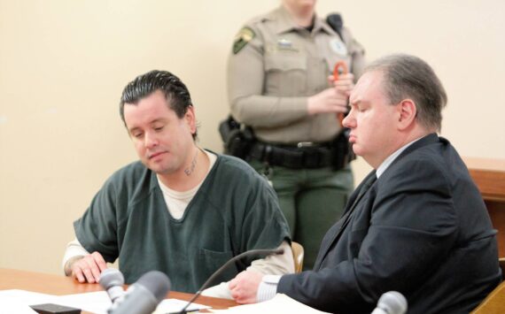 Isaiah Long (left) sits aside his defense attorney during a March 24 sentence hearing. Elisha Meyer/Kitsap News Group