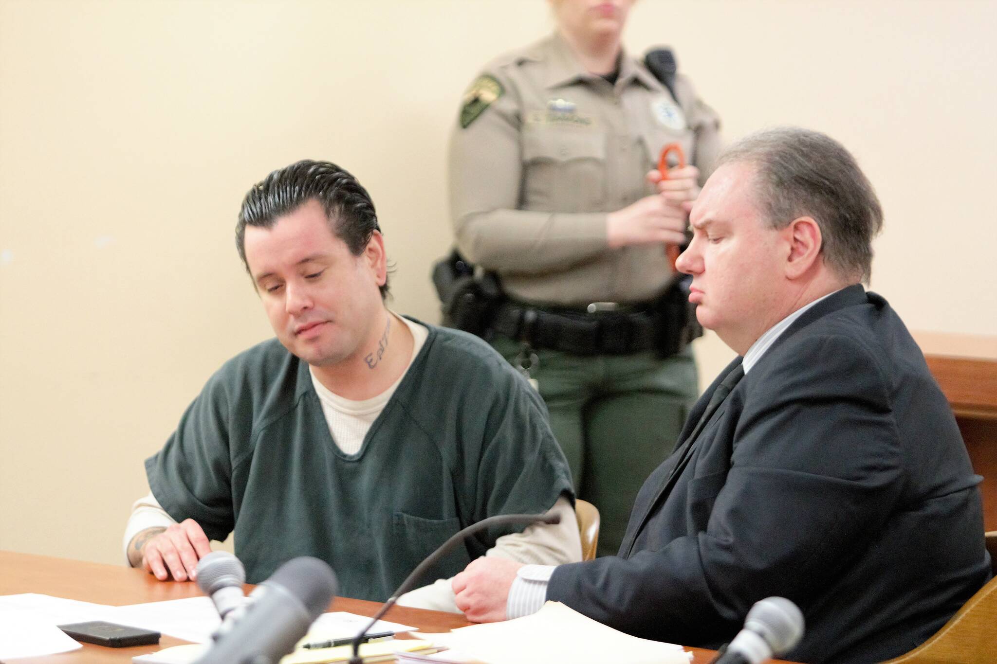 Isaiah Long (left) sits aside his defense attorney during a March 24 sentence hearing. Elisha Meyer/Kitsap News Group