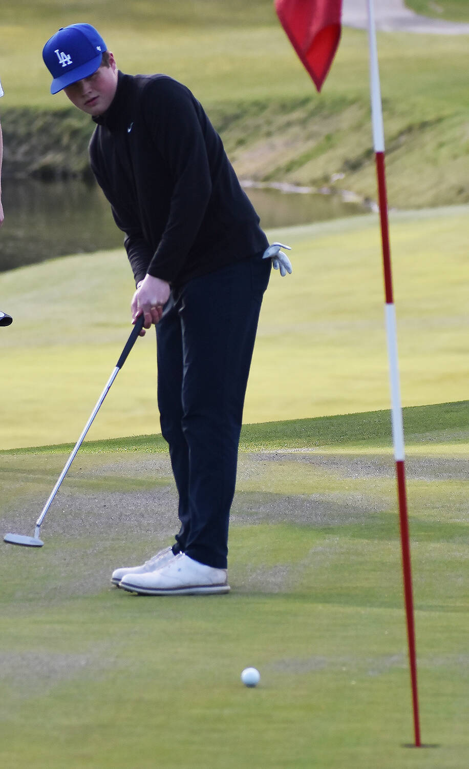 Dane Byers makes his final putt to finish with a 36 after nine holes. Nicholas Zeller-Singh/Kitsap News Group Photos