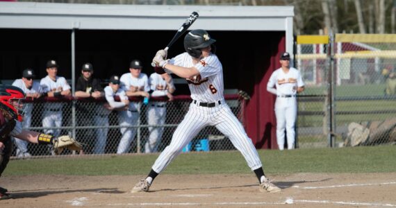 Senior Braydon Olson loads up on a swing that would provide the Wolves with their first run of the game. Elisha Meyer/Kitsap News Group Photos