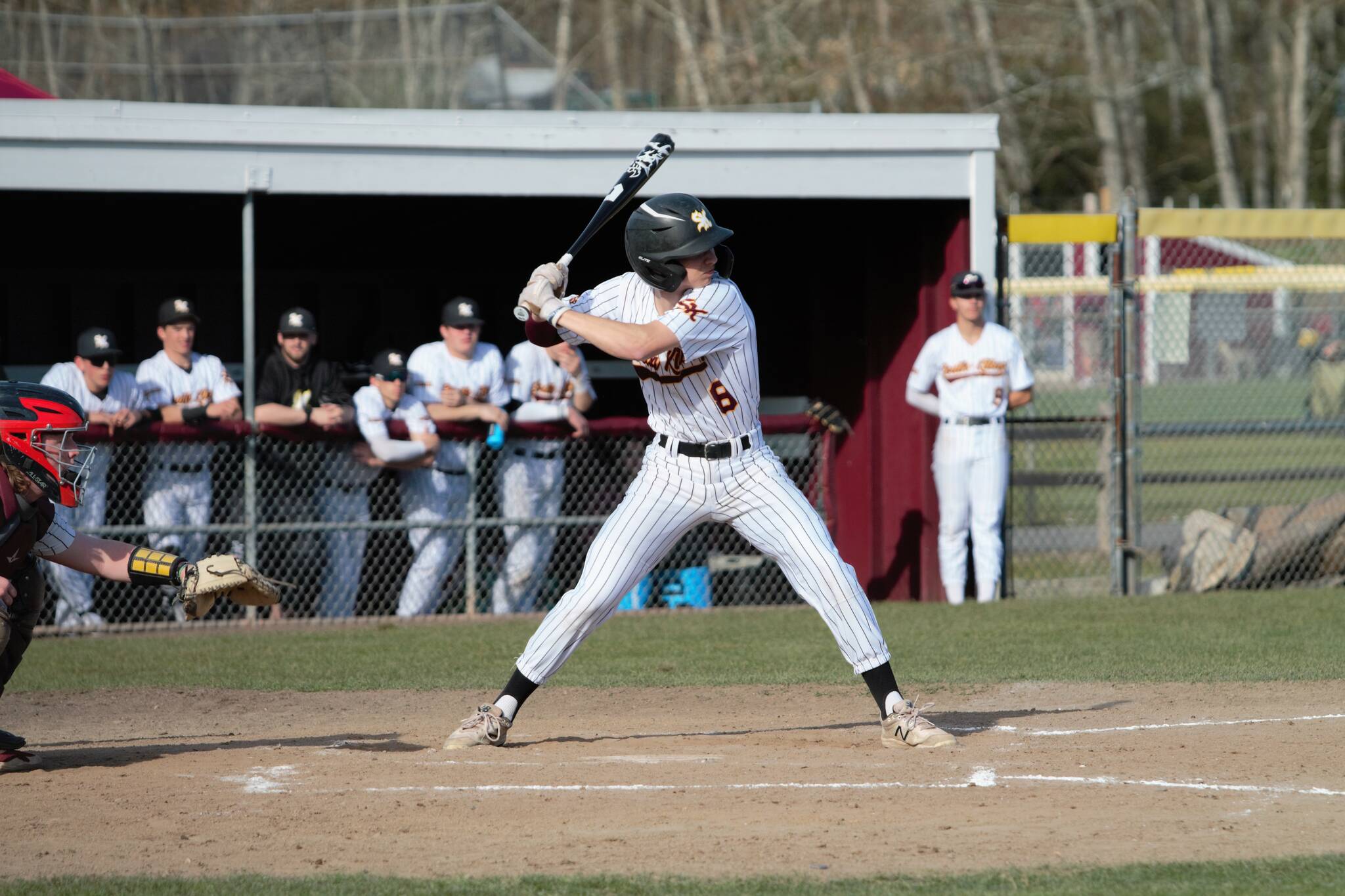 Senior Braydon Olson loads up on a swing that would provide the Wolves with their first run of the game. Elisha Meyer/Kitsap News Group Photos