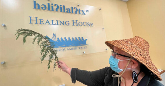 Suquamish tribal member Della Crowell helps bless the Healing House health clinic during a traditional ceremony in July of 2022 as the tribe first prepared to begin opening the new clinic for COVID testing, vaccinations and other community health nursing services. Jon Anderson courtesy photos