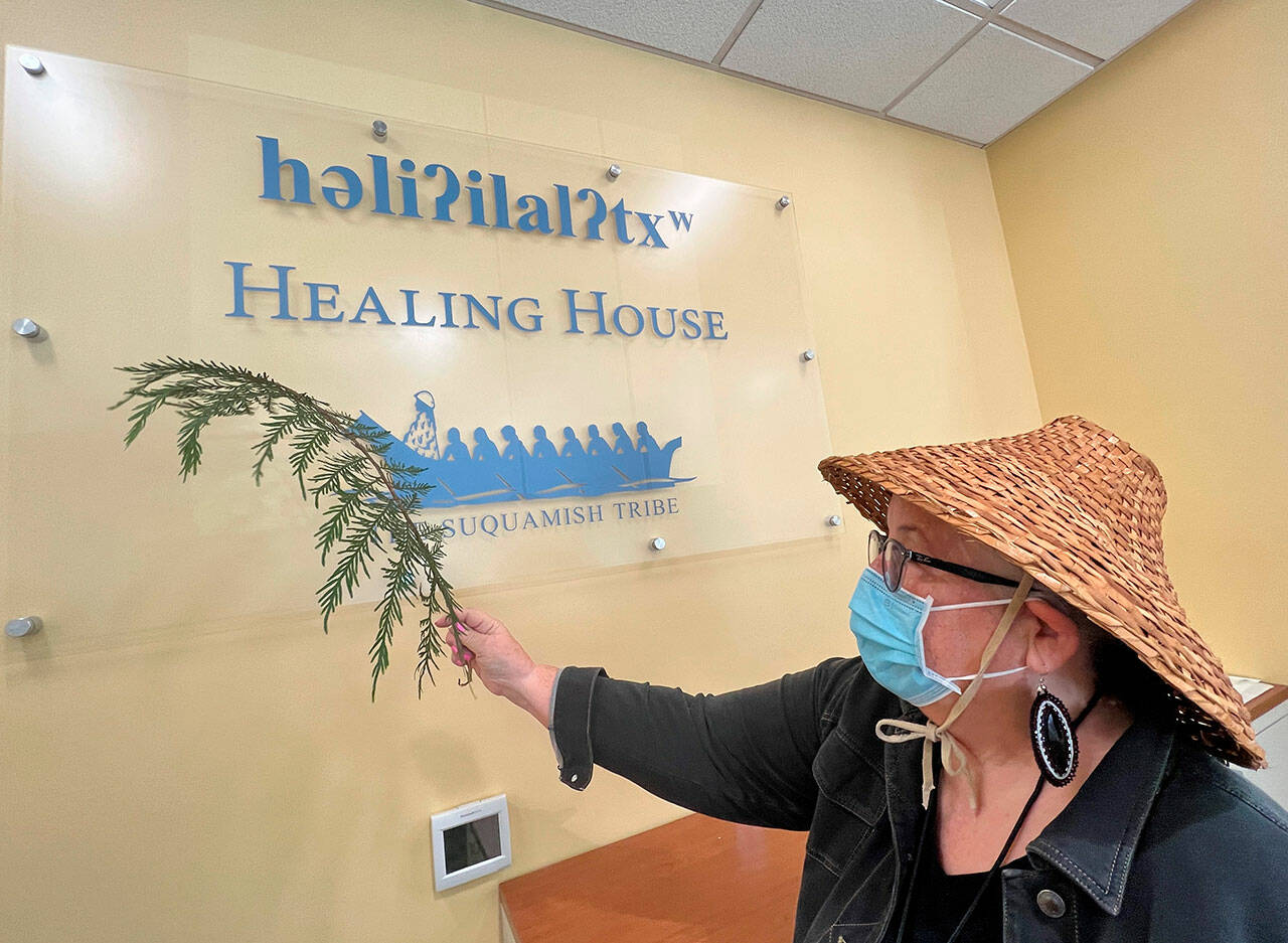 Suquamish tribal member Della Crowell helps bless the Healing House health clinic during a traditional ceremony in July of 2022 as the tribe first prepared to begin opening the new clinic for COVID testing, vaccinations and other community health nursing services. Jon Anderson courtesy photos