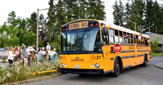 A bus driver takes a group of 2022 Bainbridge High School graduates for a spin around the Madison Avenue and High School Road roundabout on their way to Grad Night festivities. File Photo