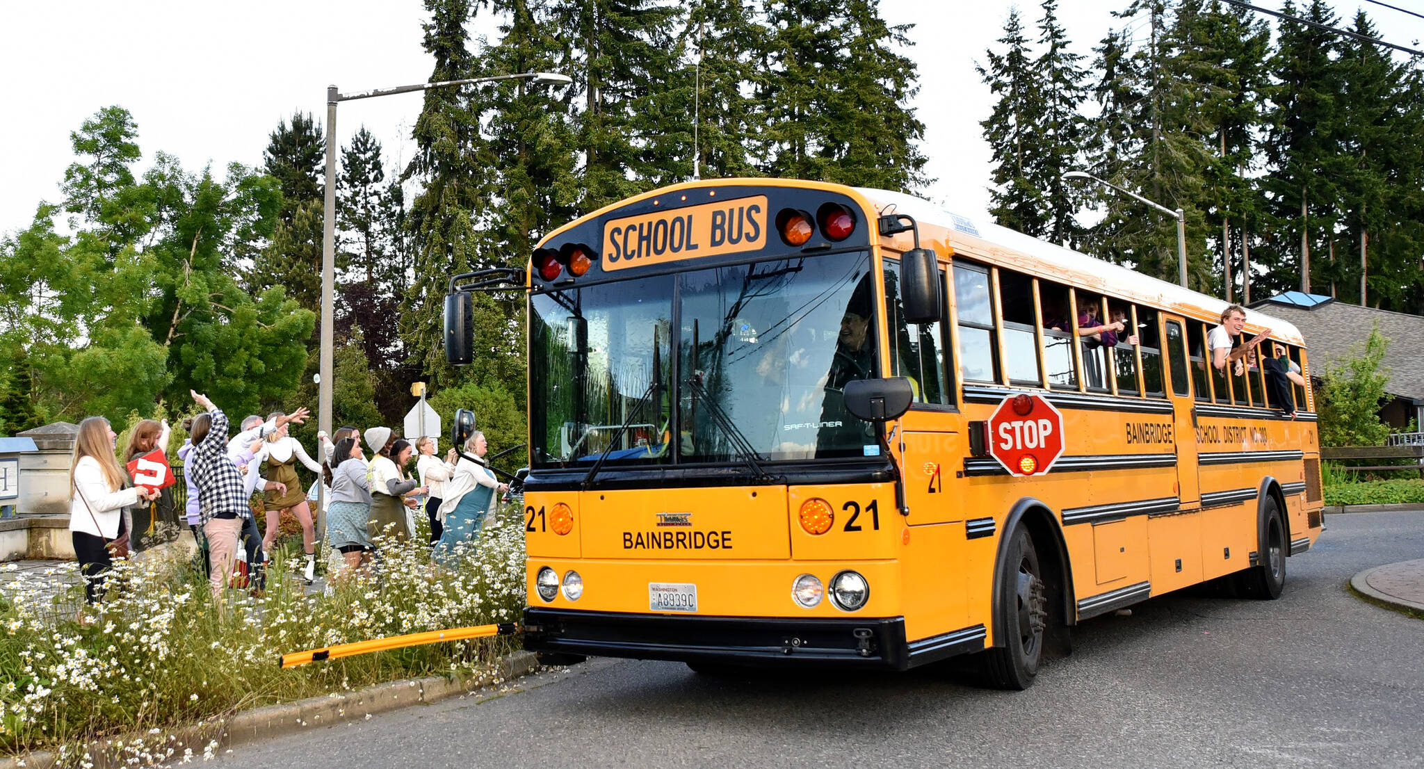 A bus driver takes a group of 2022 Bainbridge High School graduates for a spin around the Madison Avenue and High School Road roundabout on their way to Grad Night festivities. File Photo