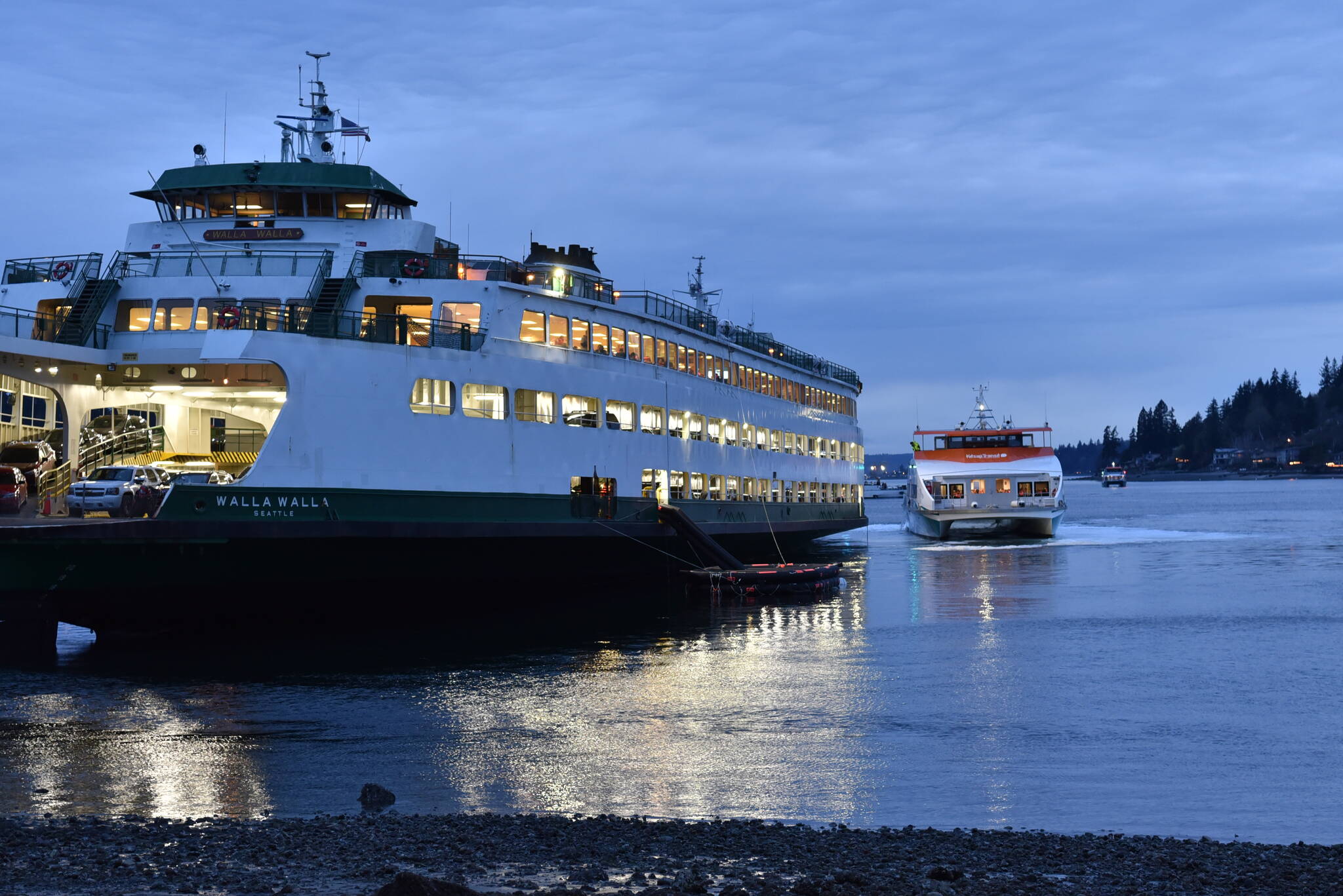 The first group of 243 passengers departs the Walla Walla on a foot ferry bound for Bremerton.