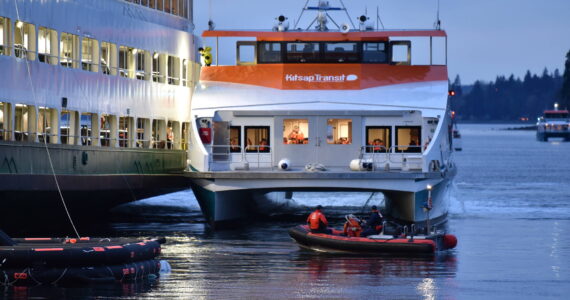 A Kitsap foot ferry parked alongside the Walla Walla to load passengers and take them to Bremerton. Nancy Treder/Kitsap News Group Photos