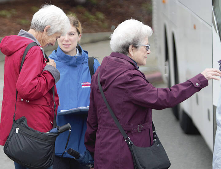 Some women board a bus to go to Poulsbo last week.