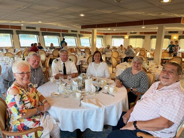 Capt. Michael Hanten and his wife Joan dine with passengers on a cruise trip. Joan Hanten courtesy photos