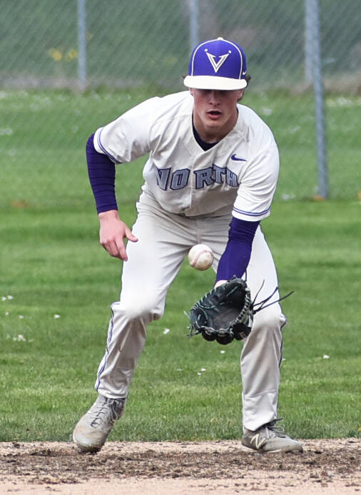 NK’s Cole Edwards forces the first out of the game. Nicholas Zeller-Singh/Kitsap News Group Photos