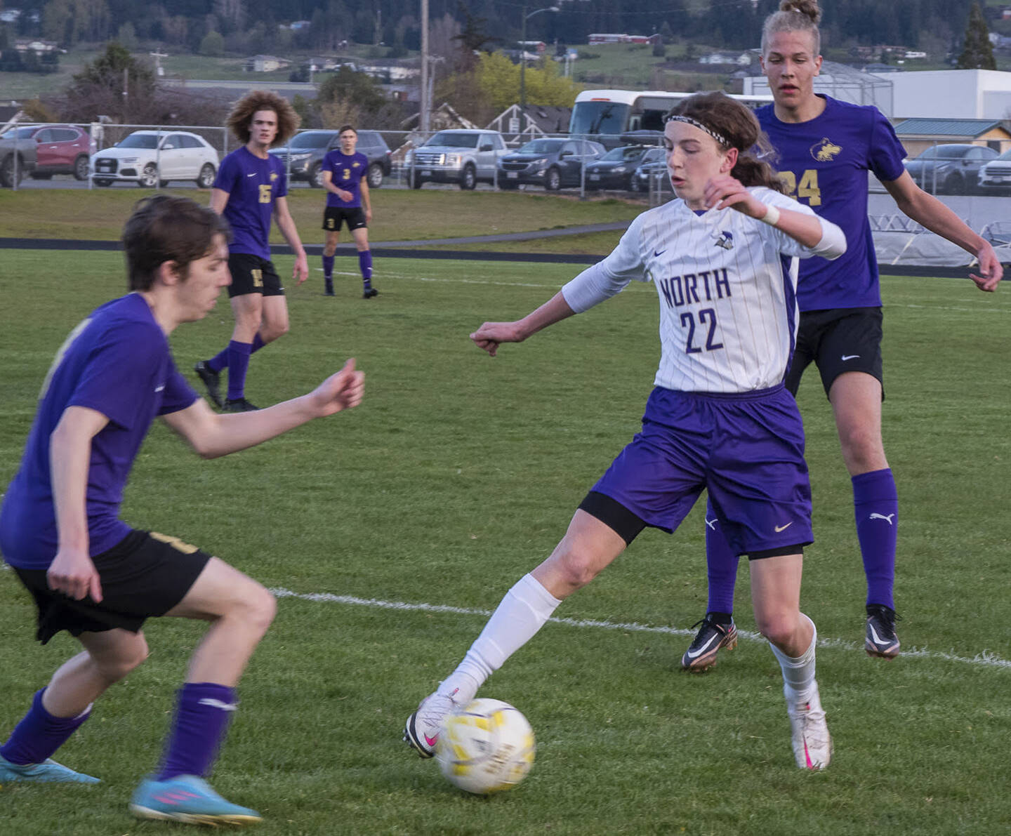 North Kitsap's Harper Sabari dribbles around a Wolve defender in their game April 25 in Sequim. The Vikings picked up a 2-0 victory. Emily Matthiessen/Sequim Gazette