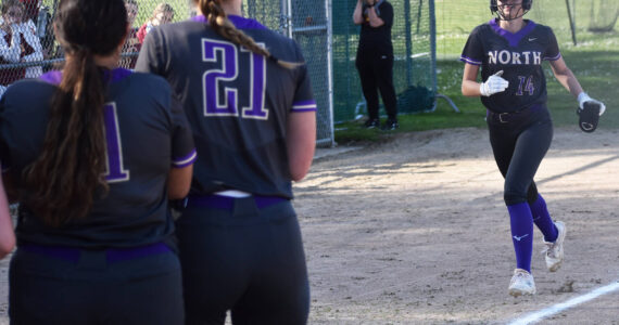 Reese Anderson hits a solo home run to break the tie between NK and Kingston. Nicholas Zeller-Singh/Kitsap News Group Photos