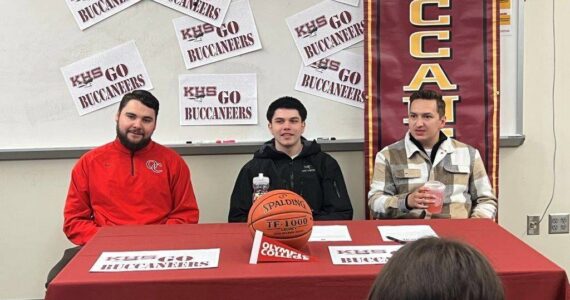 Kingston’s Dakota Standley signs his letter of intent to Olympic College to play basketball. Ed Call Courtesy Photos