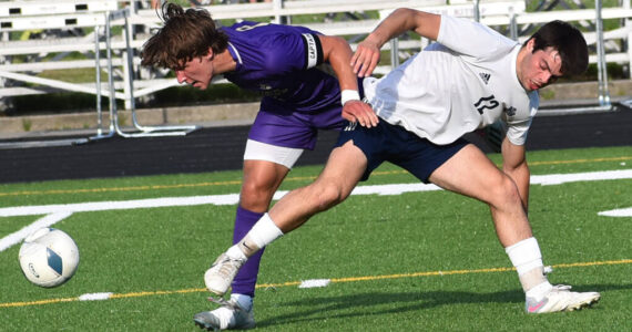 Mason Chmielewski fights for a ball at midfield. Nicholas Zeller-Singh/Kitsap News Group Photos