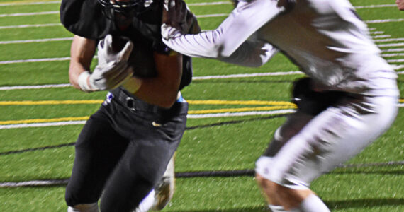 Benen Lawler uses football as a way to fit into the community and give back to the youth. File Photo