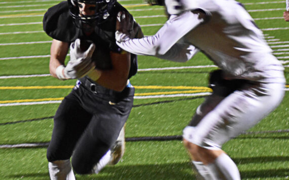 Benen Lawler uses football as a way to fit into the community and give back to the youth. File Photo
