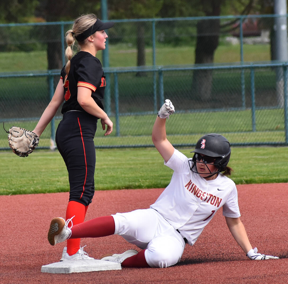 Kingston’s Audrey Rienstra slides into second base. Nicholas Zeller-Singh/Kitsap News Group Photos