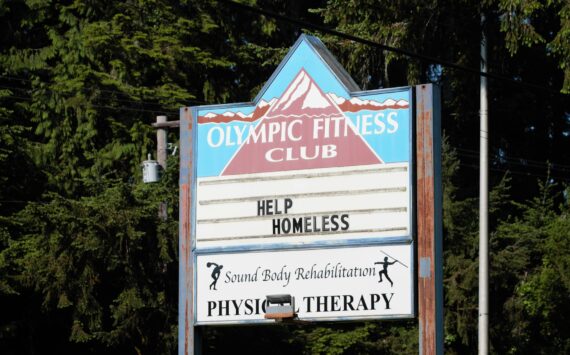 The sign of the old Olympic Fitness Club reads "Help Homeless" Elisha Meyer/Kitsap News Group Photos