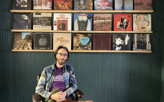 Amanda Markovich courtesy photo
Julian Maltby displays a few of the vinyl records customers could see in the new C-Side Records.
