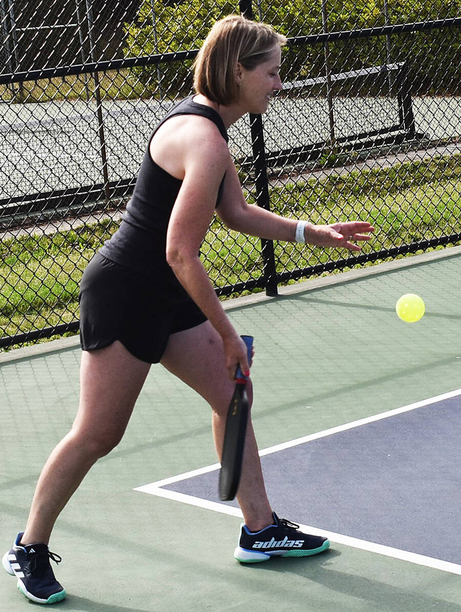 Madeleine Lapke gets set to hit a ground stroke from the baseline.