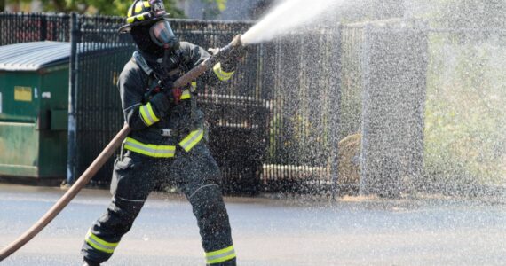 A firefighter works the hose during a training exercise for South Kitsap Fire and Rescue. Elisha Meyer/Kitsap News Group Photos