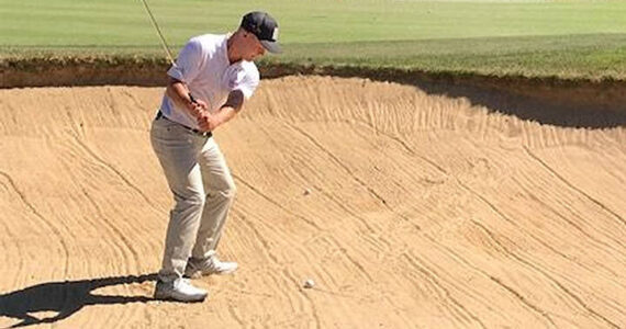 Mike De Felice/Kitsap News Group 
One course installed a practice sand trap area to help golfers like this one.