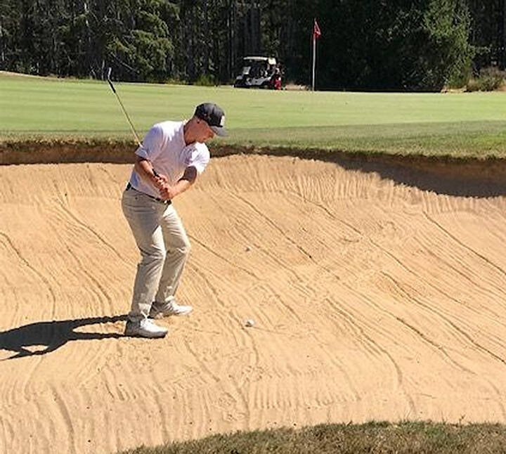 Mike De Felice/Kitsap News Group 
One course installed a practice sand trap area to help golfers like this one.
