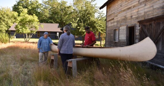 Susan Goodwin speaks with the Nelson family who traveled from Kalispell, MT to pick up the canoe to return it to the Conrad Mansion Museum. Nancy Treder/Kitsap News Group Photos