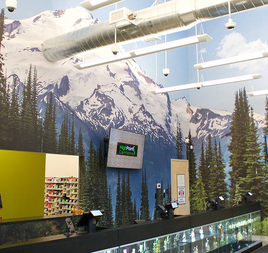 The vinyl wrap on the wall includes a picture of Mount Rainier.