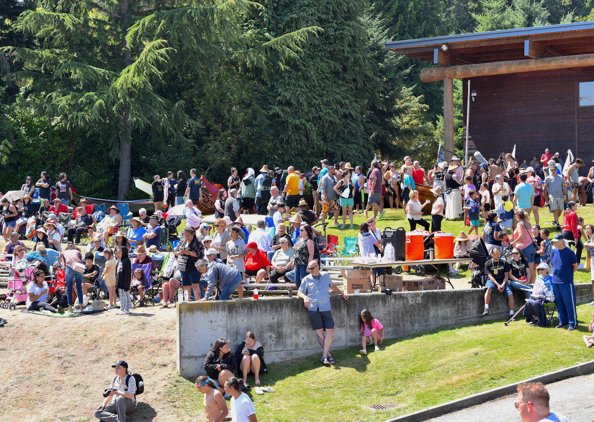Hundreds of spectators watch canoes arrive at Suquamish on the sixth day of the Canoe Journey on the Salish Sea.