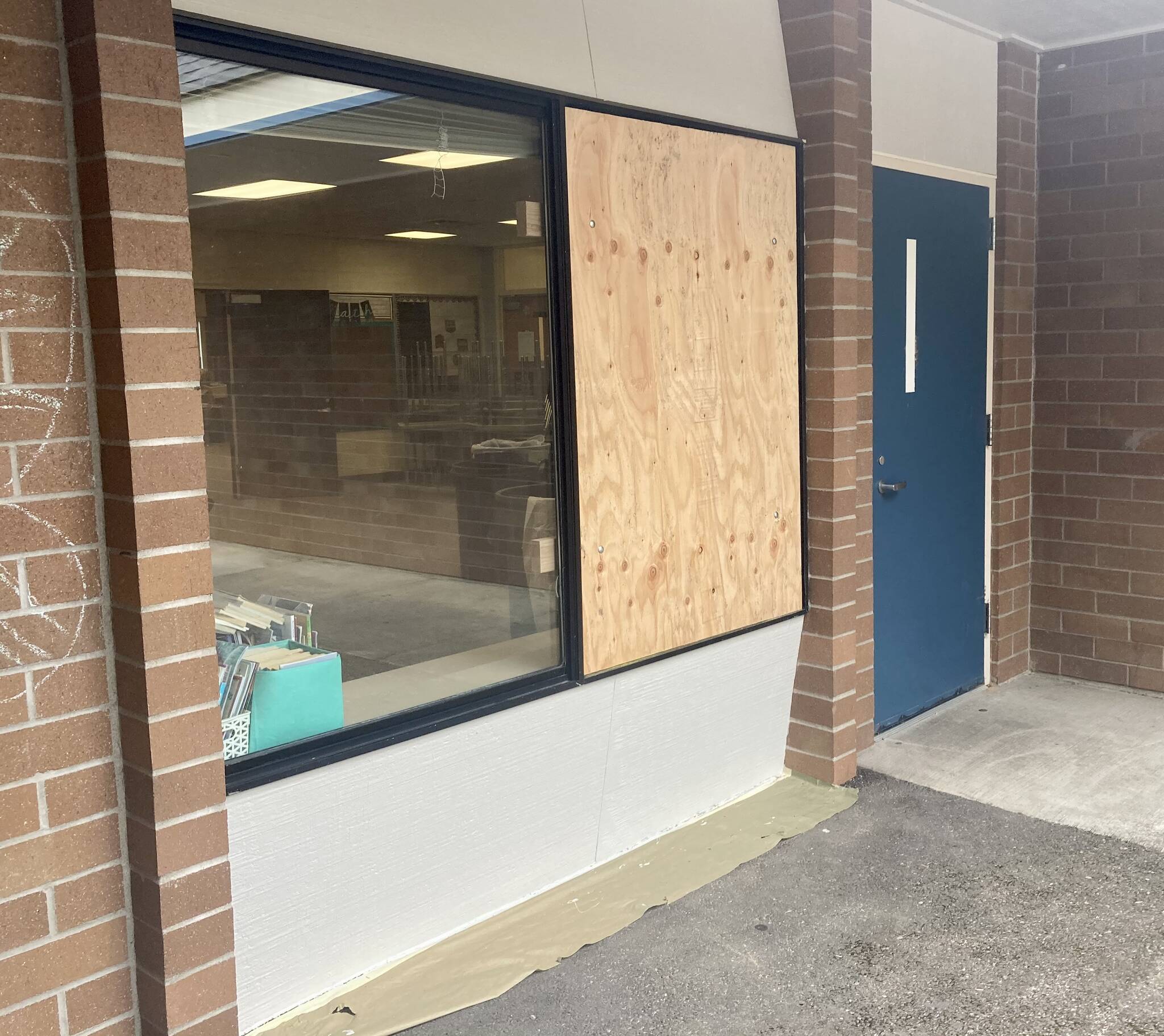 A window outside a third-grade classroom at Manchester Elementary is boarded up after it was shattered in the break-in. Elisha Meyer/Kitsap News Group Photos