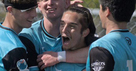 Kolby Juarez, left, Connor Louden, Gabe Threadgold and Peter Radovich celebrate Threadgold’s second-half penalty kick conversion giving Port Orchard its first lead of the match. Jesse MacKenzie courtesy photos