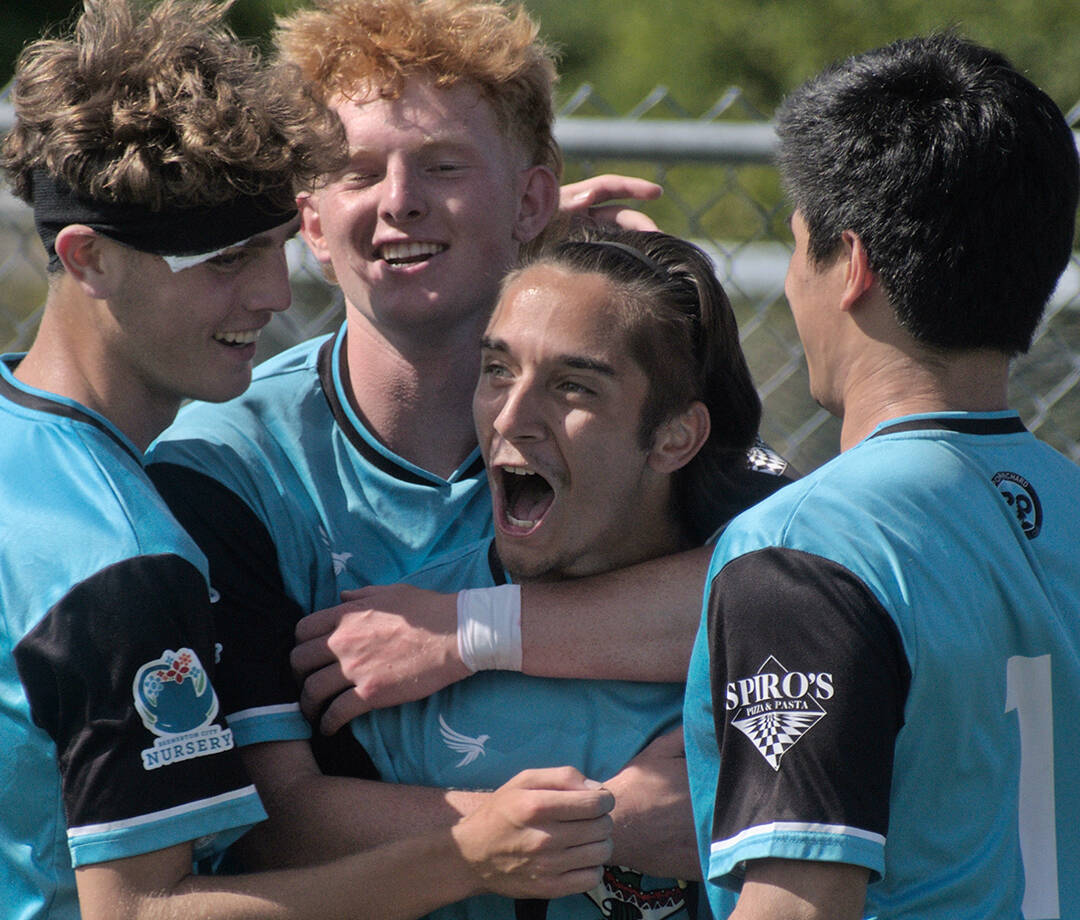 Kolby Juarez, left, Connor Louden, Gabe Threadgold and Peter Radovich celebrate Threadgold’s second-half penalty kick conversion giving Port Orchard its first lead of the match. Jesse MacKenzie courtesy photos