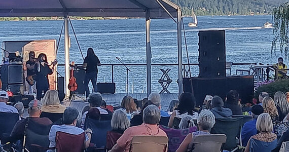 Third Stage, a Boston tribute band, performs outdoors and the cost was free at the Clearwater Casino's classic concert venue Aug. 3. Boats can be seen plying the waters in the background. Fans packed the site and enjoyed food and drinks, along with the music from just another band out of Boston. Steve Powell/Kitsap News Group Photos