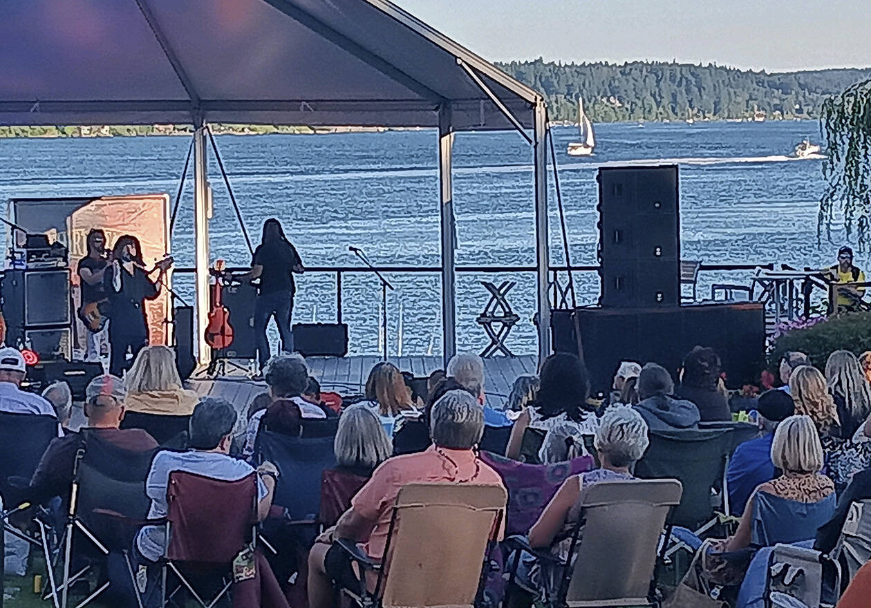 Third Stage, a Boston tribute band, performs outdoors and the cost was free at the Clearwater Casino's classic concert venue Aug. 3. Boats can be seen plying the waters in the background. Fans packed the site and enjoyed food and drinks, along with the music from just another band out of Boston. Steve Powell/Kitsap News Group Photos