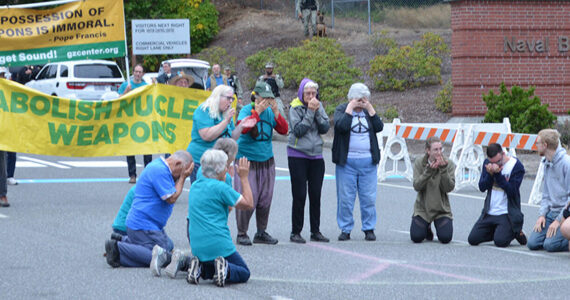 A group attending the three-day Ground Zero conference protests in the street leading to the Bangor base. Ground Zero courtesy photo