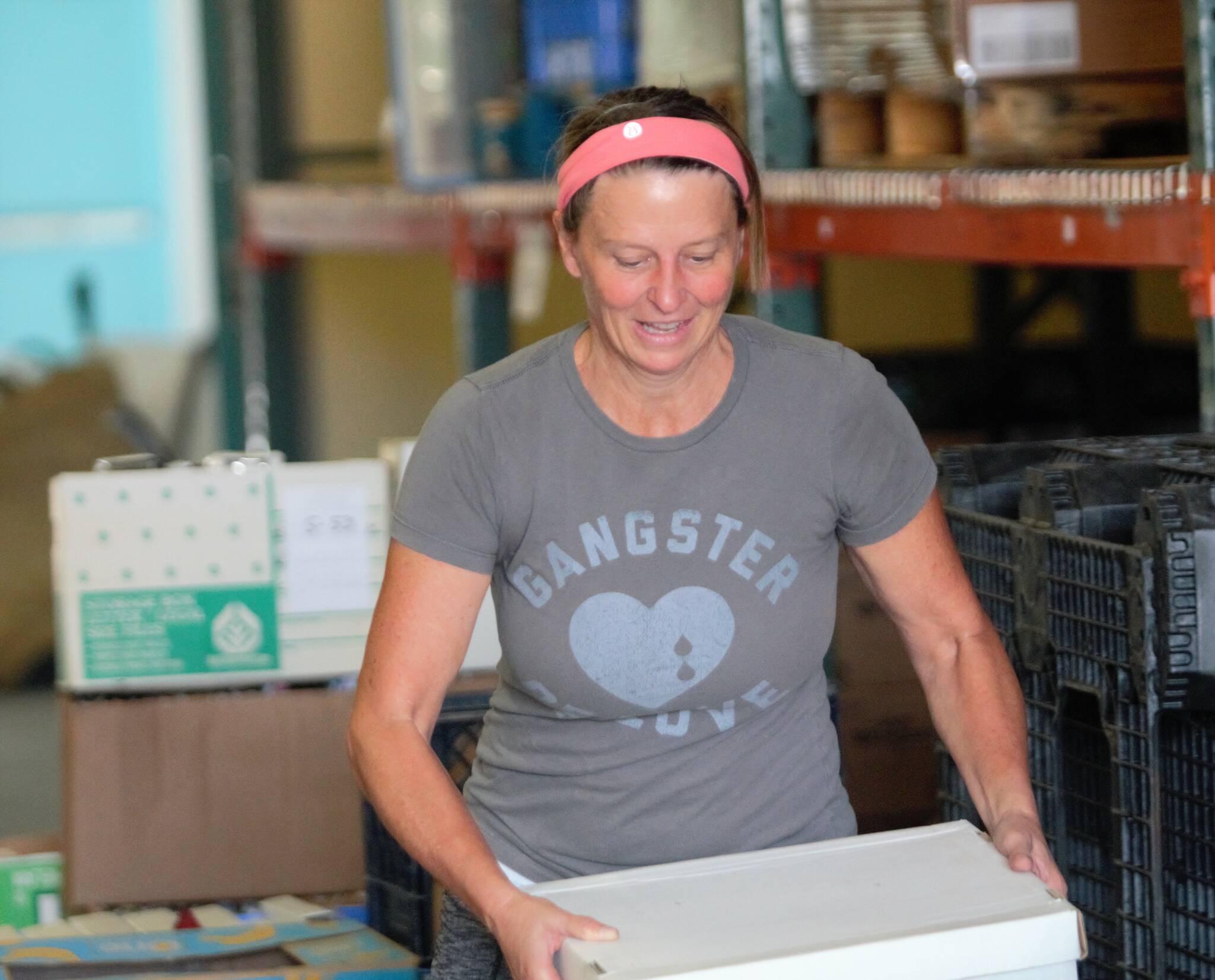 Elisha Meyer/Kitsap News Group
Cori Kauk moves around some boxes during a major clean-up.