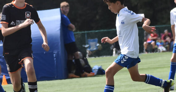 Nicholas Zeller-Singh/Kitsap News Group Photos
The Island Cup, which brings 89 soccer teams of all ages to Bainbridge Island, is taking place this weekend at Battle Point Park, Woodward Middle and Bainbridge High. BI Football Club is one of the teams. Here, Brady Treve dribbles into the opponent’s defense.