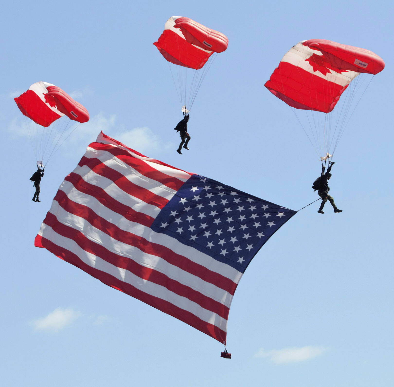 Elisha Meyer/Kitsap News Group Photos
The Skyhawks present the American flag in a rehearsal jump.
