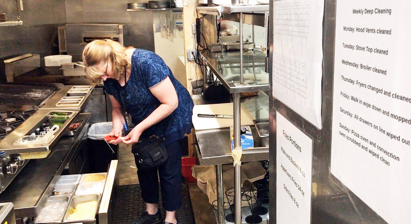 KPHD courtesy photos
Kitsap Public Health District inspector Susan Van Ort does food safety inspections at restaurants to ensure food is prepared and stored under sanitary conditions.