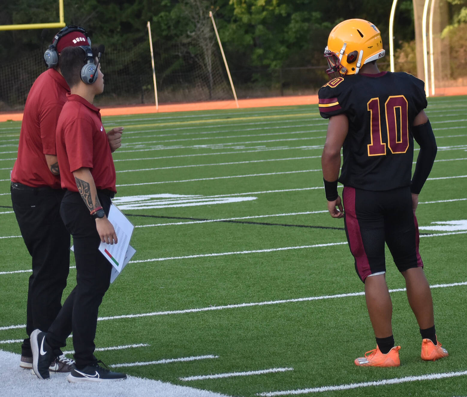 New Kingston coach Ethan Goldizen discusses the play with Swan on the sideline.