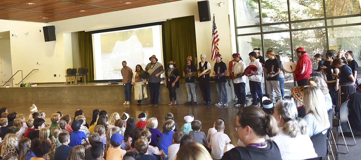 Suquamish tribal members share their culture and traditions with x̌alilc Elementary School students Sept. 8.