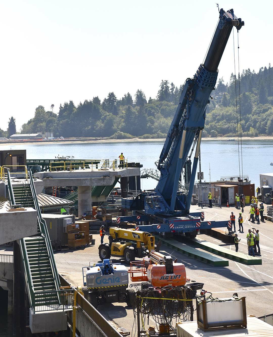 Nancy Treder/Kitsap News Group Photos
A crane is moved into place that will be used to set the walkway spans in place.