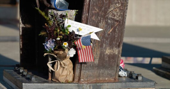Elisha Meyer/Kitsap News Group Photos
Flowers are placed at the base of the steel beams of the Kitsap 9/11 Memorial in Silverdale.