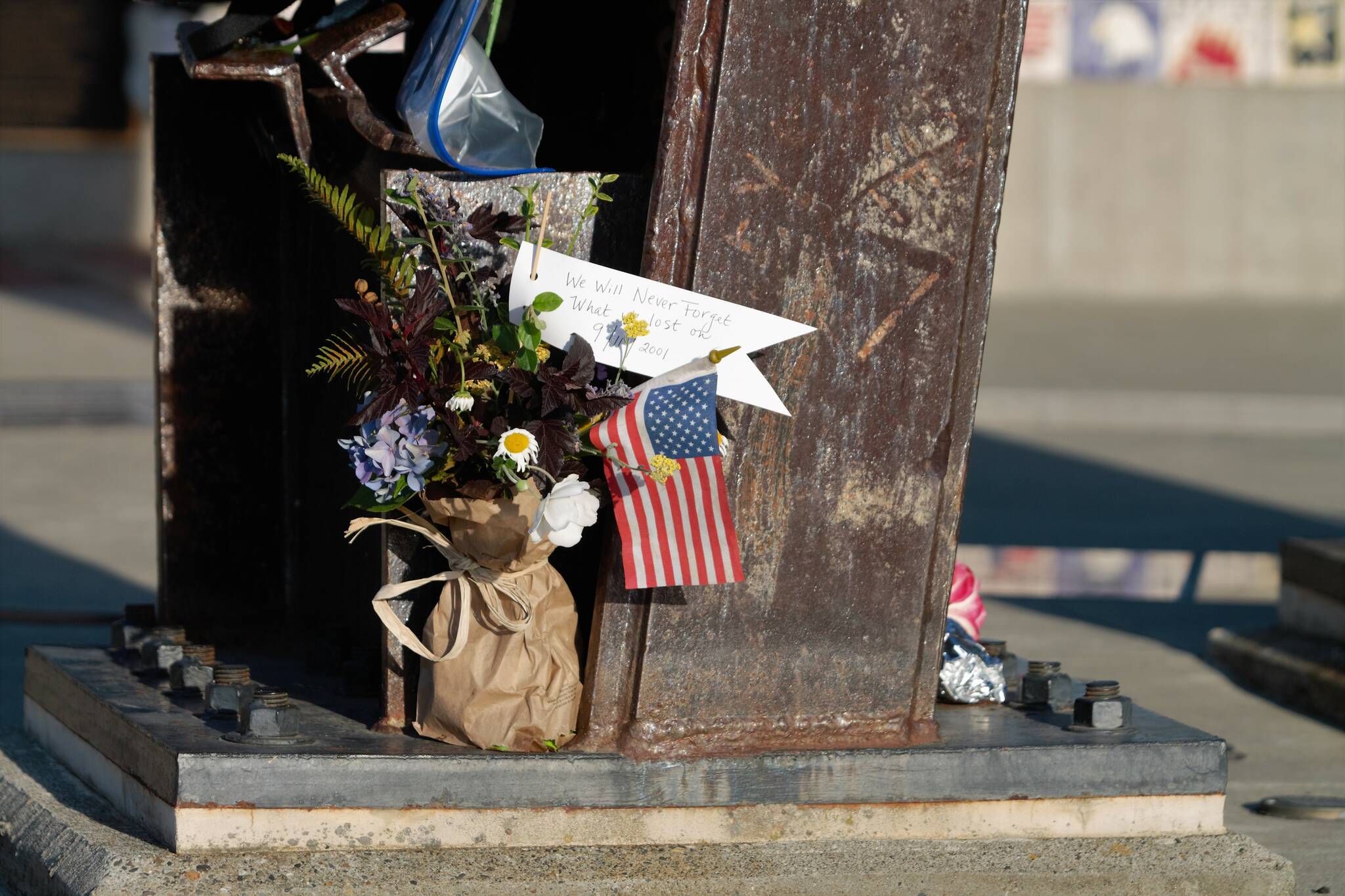 Elisha Meyer/Kitsap News Group Photos
Flowers are placed at the base of the steel beams of the Kitsap 9/11 Memorial in Silverdale.