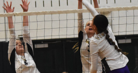 Nicholas Zeller-Singh/Kitsap News Group Photos
North Kitsap’s Silvia Okunami picks up a kill for the Vikings.