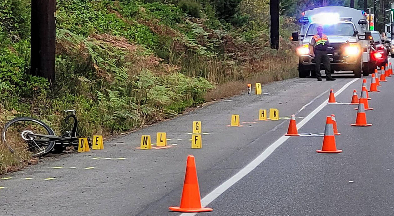 KCSO courtesy photo  
A bicycle lies on the side of the road in Hansville following a hit-and-run collision early Sept. 19 that resulted in critical injuries to a male cyclist who was airlifted to Harborview Medical Center in Seattle. The suspect has been charged.
