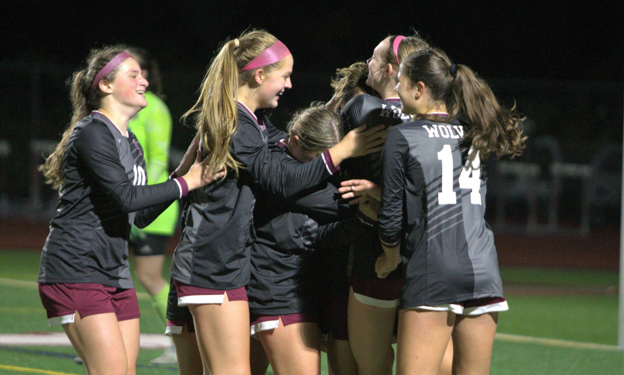 Elisha Meyer/Kitsap News Group
Melanie Rojas-Perez is surrounded by her teammates after securing the game-winning goal on a stoppage-time penalty kick.