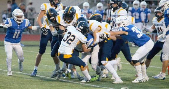 Elisha Meyer/Kitsap News Group Photos
A multitude of Spartans take down the return man on a kickoff vs. the Olympic High Trojans.